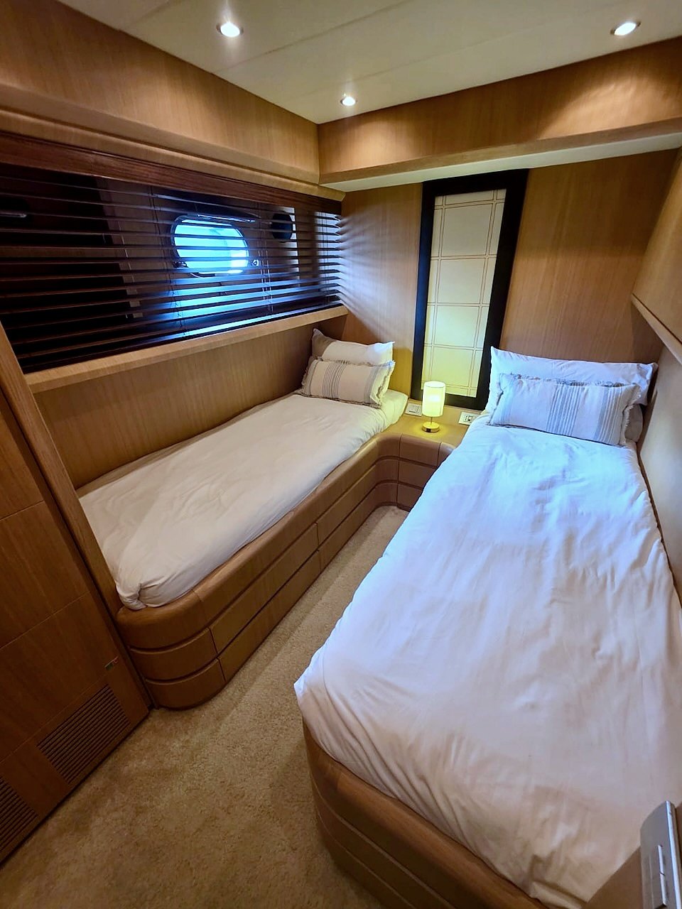Twin guest cabin aboard the Limitless yacht