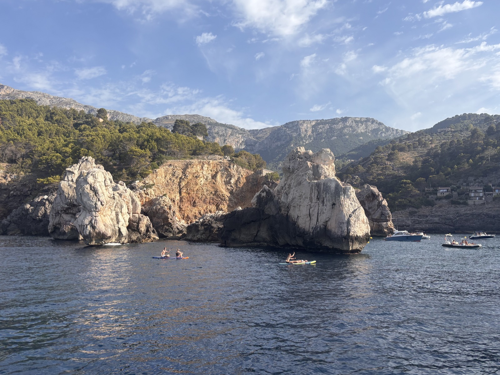 Paddleboarders among the rock formations at Portals Vells