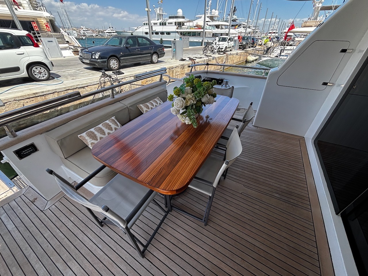 Aft deck dining area of the Limitless yacht