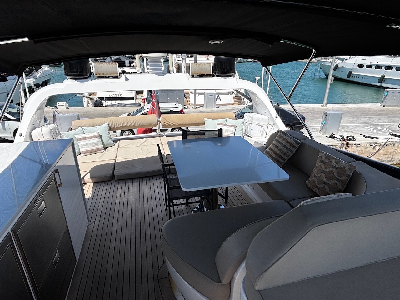 Flybridge lounge and dining on the Limitless yacht