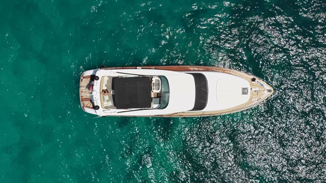 Aerial top-down view of Limitless on turquoise open water