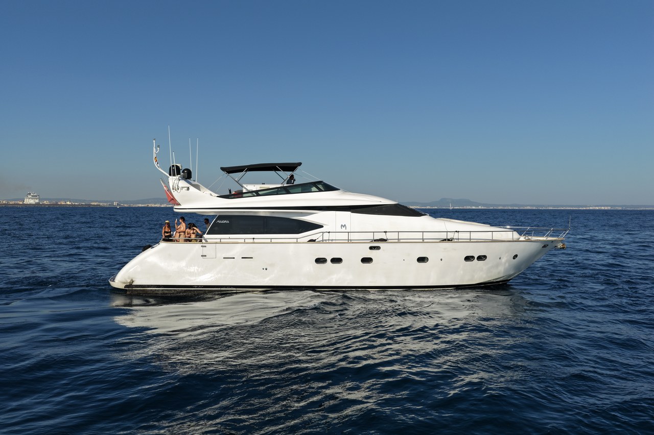 Limitless yacht on calm Mediterranean waters with guests relaxing on deck